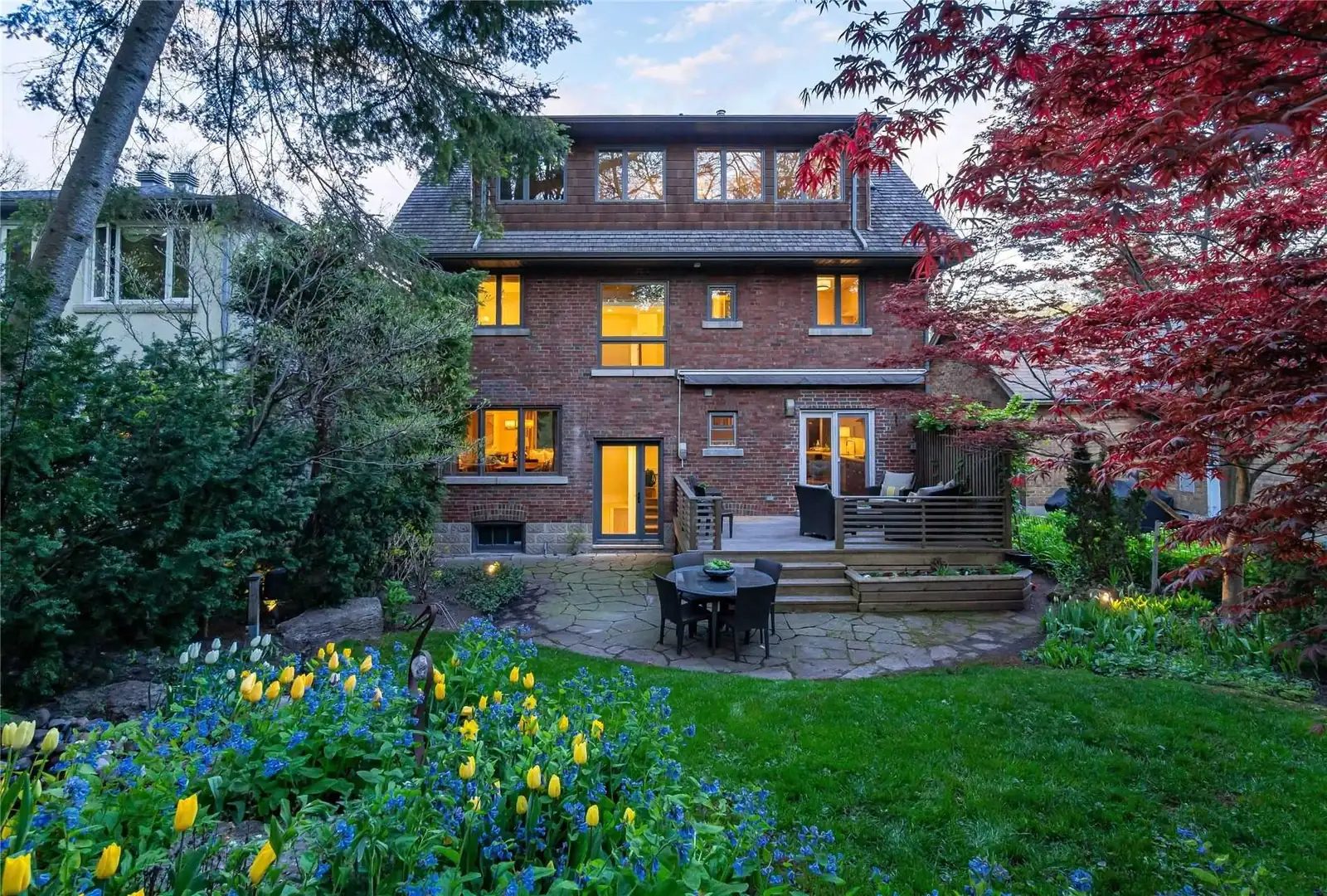 The original brick rear of the house with a wood deck, before the addition, Quiet Oasis project.