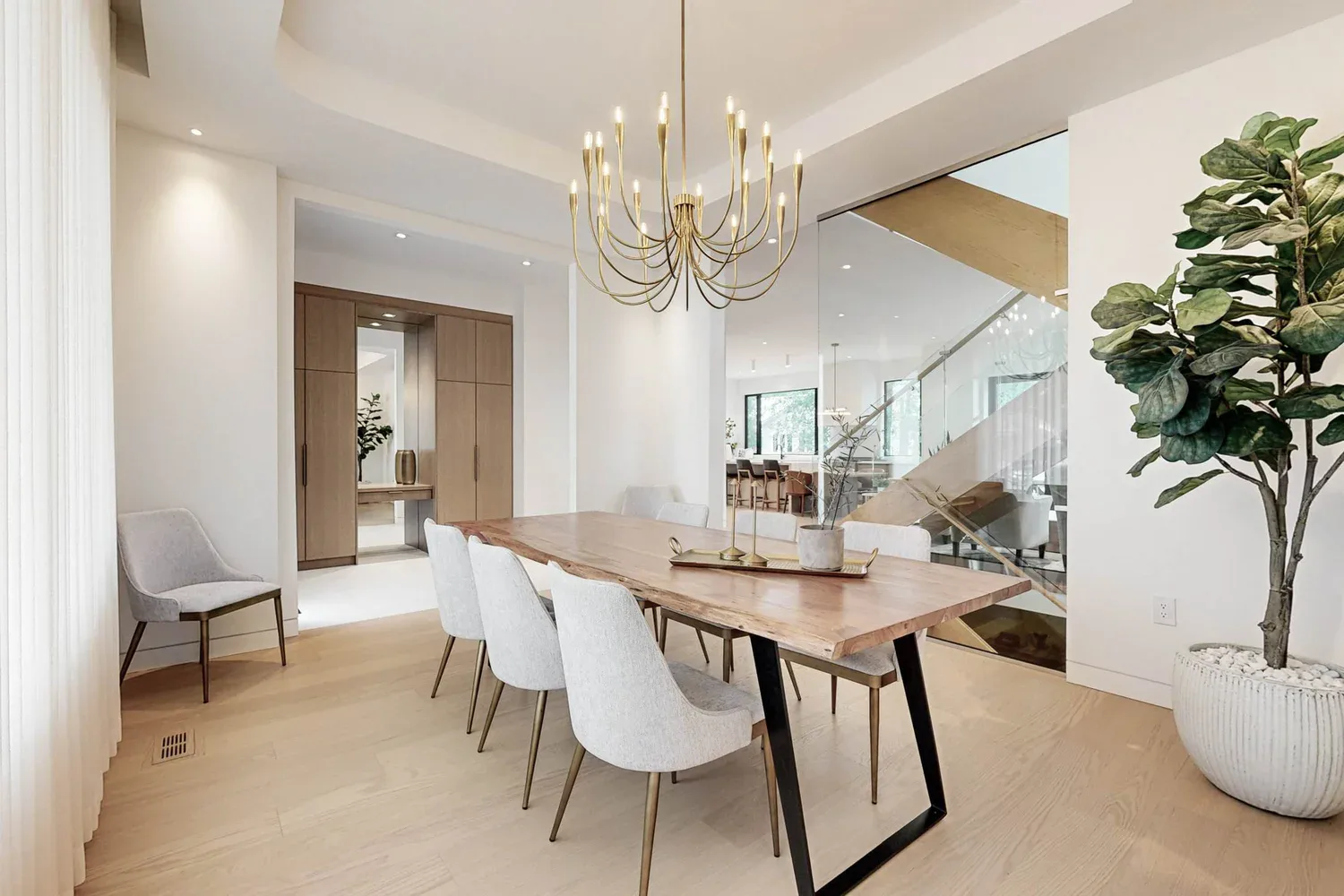 After renovation, open dining area within an Etobicoke custom build.