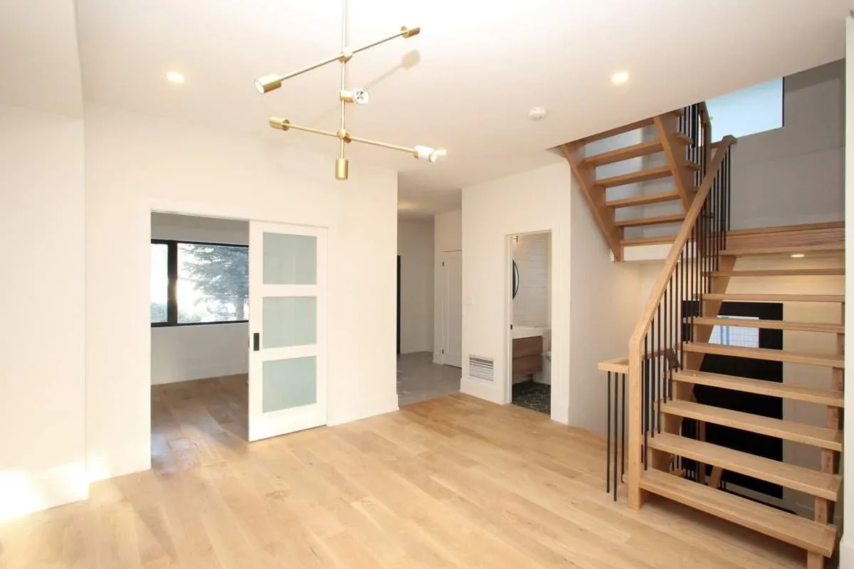 Bright upper landing after an Alderwood second-storey addition and reconfiguration.